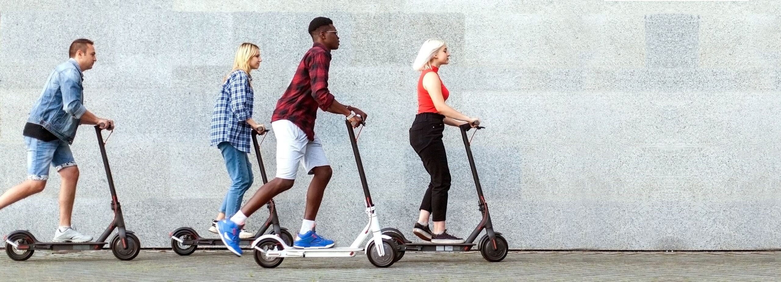 Picture of four people riding E-Scooters (Source: City of Springfield webpage: https://www.springfieldmo.gov/5661/E-Scooters-Micromobility)
